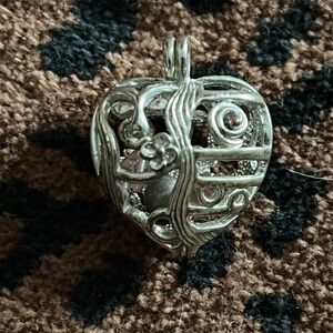 Adorable sterling silver open work heart shaped pendant